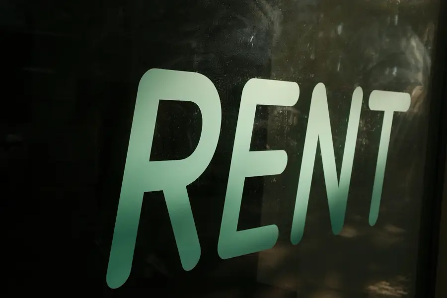 The word RENT in large letters.
